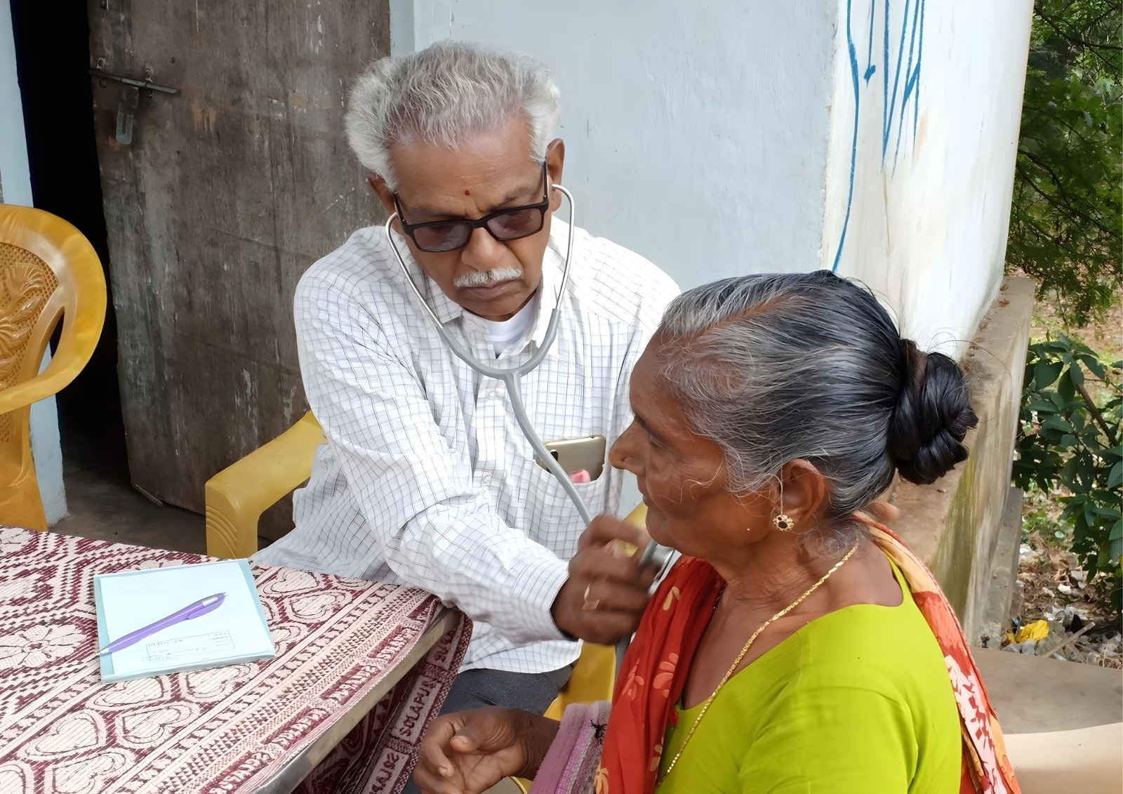 Volunteers distributing supplies to elderly community members.